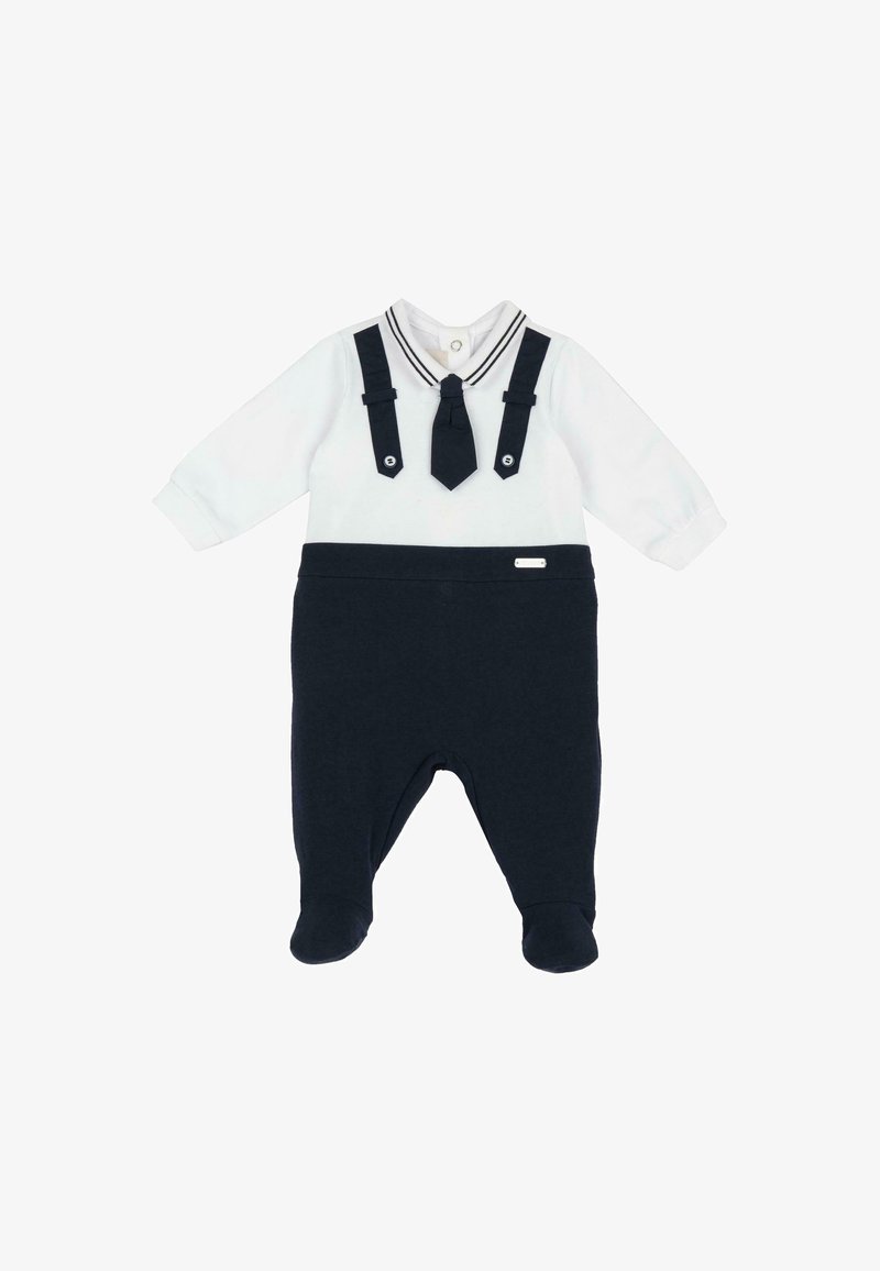 Bodysuit pour bébé avec manches longues blanches, cravate noire attachée, bretelles noires et pantalon noir avec pieds.