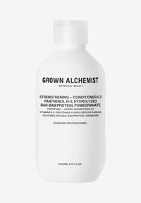 Bouteille en plastique blanc au design arrondi, avec une étiquette en texte noir précisant les ingrédients et l'utilisation du produit. Bouchon à vis sécurisé.