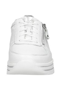 White sneaker featuring a textured leather upper, lace closure, and a zip detail on the side. Thick white sole for added comfort.