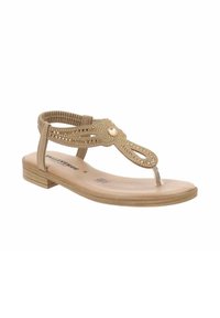 I sandali piatti beige presentano un design decorativo a taglio con accenti metallici, una fascia traslucida tra le dita e un tacco piatto con texture.