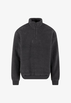 Fleece-Pullover in Dunkelgrau mit hohem Kragen, halbem Reißverschluss, elastischen Bündchen und Saum; weiche Textur mit kleinem Logo auf der Vorderseite.