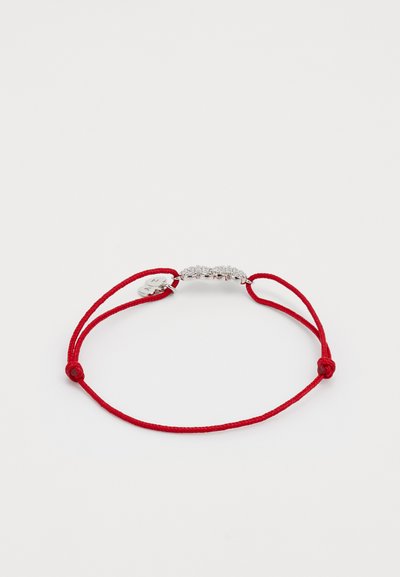 Red adjustable cord bracelet featuring a silver-colored metallic centerpiece with multiple clear gems, secured by a simple knot.