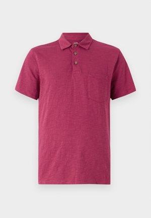 Kortärmad polo shirt i en djup hallonfärg. Tillverkad av lättviktsmaterial, med krage, tre knappslå och en bröstficka.
