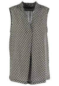 Gilet sans manches noir et blanc à motifs avec de petites formes losanges et un large col, design ouvert sur le devant.