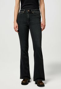 Wrangler MONTANA - Flared jeans - constellation