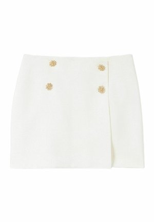 Mini-jupe blanche à coupe droite. Dotée de boutons décoratifs en métal doré en forme de fleurs sur le devant pour un détail supplémentaire. Fabriquée dans un tissu lisse.