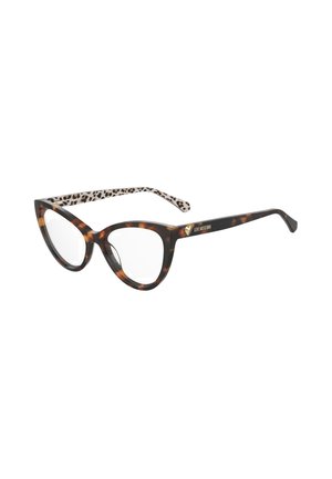 Lunettes en écaille de tortue en forme de œil de chat avec verres clairs et intérieur beige orné d'un motif léopard noir. Lettres dorées sur la branche.