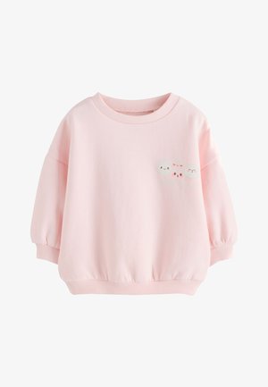 Jasnoróżowa bluza z długim rękawem dla malucha z prążkowanymi ściągaczami na mankietach i dole, z trzema małymi uśmiechniętymi buźkami chmur na piersi.