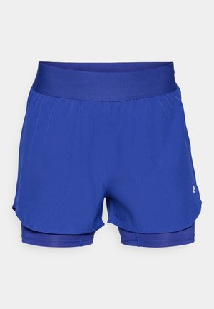 Pantalones cortos deportivos azules con una amplia cinturilla elástica, con un diseño en capas y un pequeño logo en la parte inferior derecha. Textura suave.