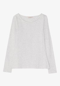 Lichtgrijze langslavenshirt met een ronde halslijn en zijsplitten. Gemaakt van een zacht, textuur materiaal, met minimale stikdetails.