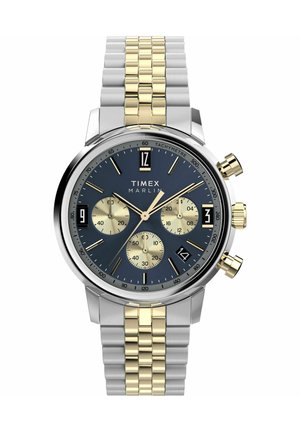 Montre Timex Marlin avec un cadran bleu, un bracelet en acier inoxydable argenté et doré, trois sous-cadrans et une fenêtre de date à quatre heures.