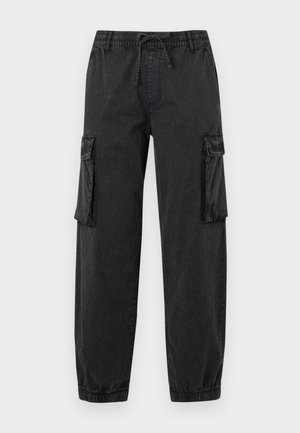 Black cargo pants made of textured fabric with an elastic waistband and drawstring. Features side pockets and elastic cuffs at the ankles.
