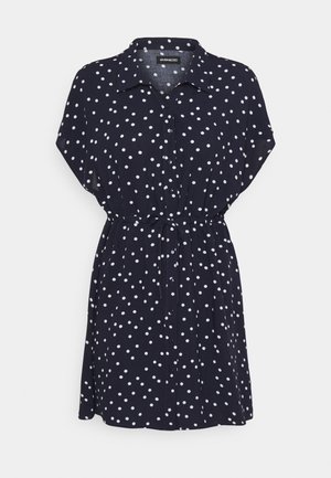 Marineblaue Kurzarm-Hemdkleid mit weißen Polka-Dots, Knopfleiste vorne, Kragen und verstellbarem Taillengürtel.