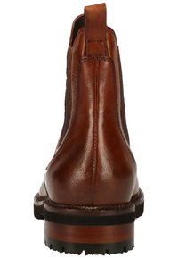 Bottine en cuir marron avec une finition lisse, panneaux latéraux élastiques, une boucle à l'arrière et une semelle en caoutchouc noir robuste.