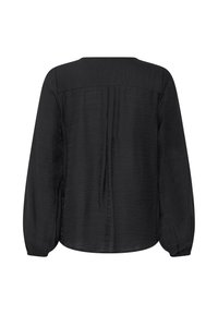 Blouse noire à manches longues avec poignets froncés et couture d’empiècement dans le haut du dos, vue de dos sur fond blanc.