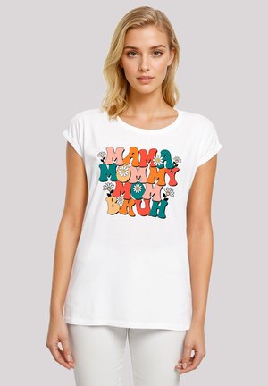 White short-sleeve t-shirt featuring colorful, playful text that reads "MAMA MOMMY MOM BRUH" with floral accents. Smooth fabric and relaxed fit.