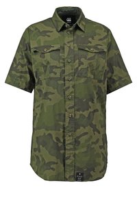 Camouflage-Muster Kurzarmhemd in Grüntönen, mit zwei Brusttaschen und Knopfleiste. Hergestellt aus leichtem Stoff mit lockerer Passform.