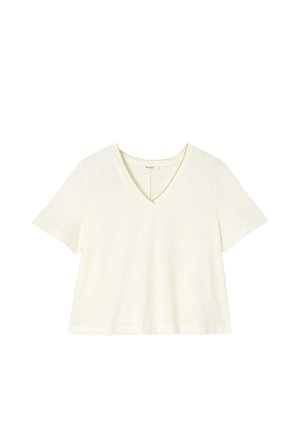 T-shirt à col en V de couleur crème clair avec des manches courtes, fabriqué en tissu doux. Coupe simple et décontractée sans motifs ni détails matériels visibles.