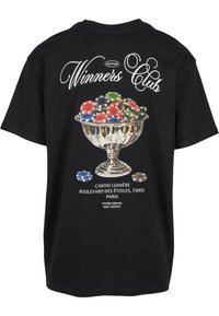 Black cotton t-shirt featuring a graphic of a silver trophy filled with colorful poker chips and text "Winners Club" on the back.