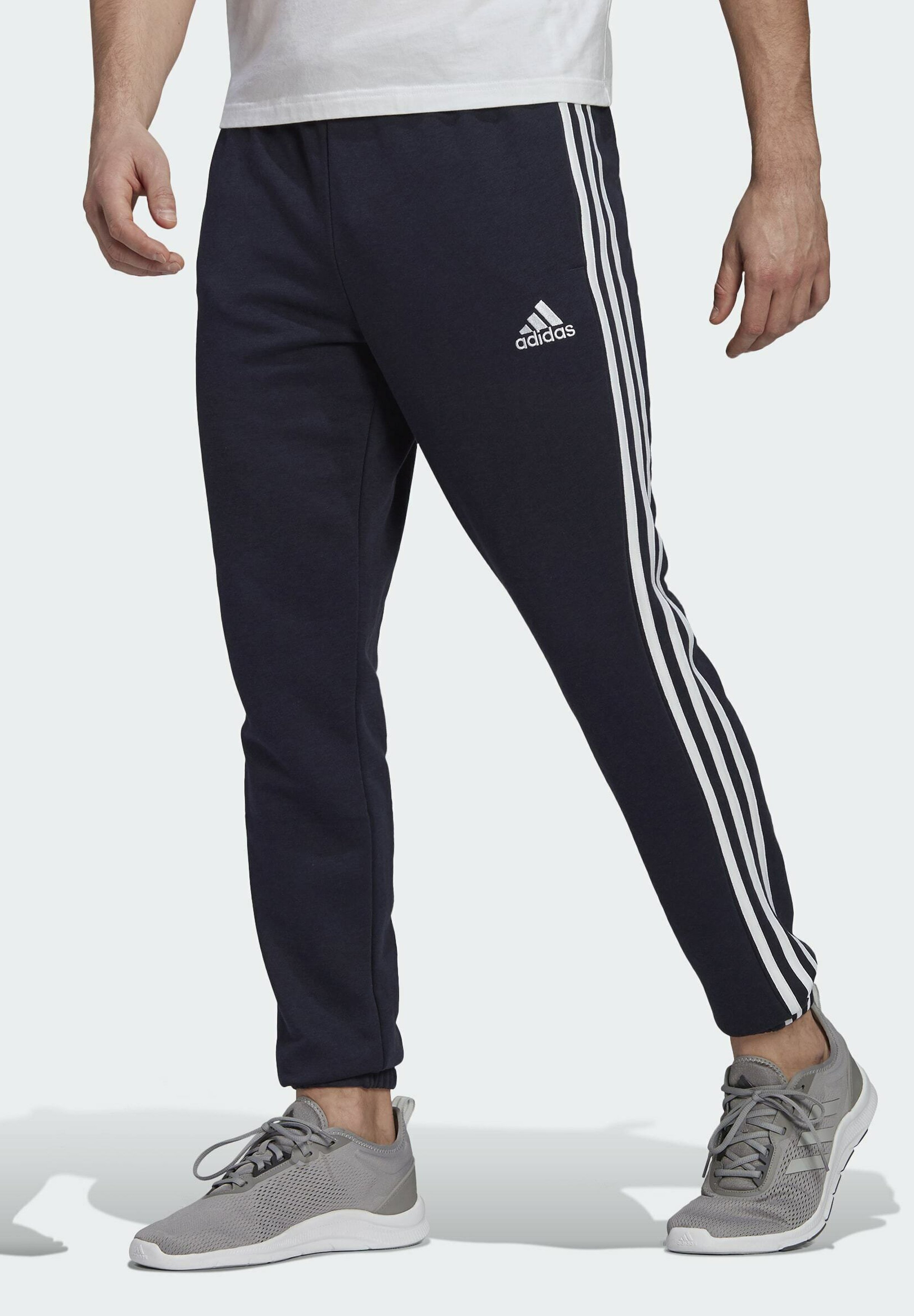 ESSENTIALS FRENCH TERRY TAPERED 3-STRIPES JOGGERS - Trainingsbroek - blue ESSENTIALS FRENCH TERRY TAPERED 3-STRIPES JOGGERS - Trainingsbroek - blue