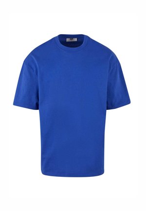 Sinine lühikeste varrukatega T-särk, mis on valmistatud puuvillast. Omab ümarat kaelust ja lõdva istuvust, lameõmblused ja ilma nähtavate mustrite või logodeta.