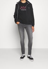 Calvin Klein Jeans Lehká bunda - black