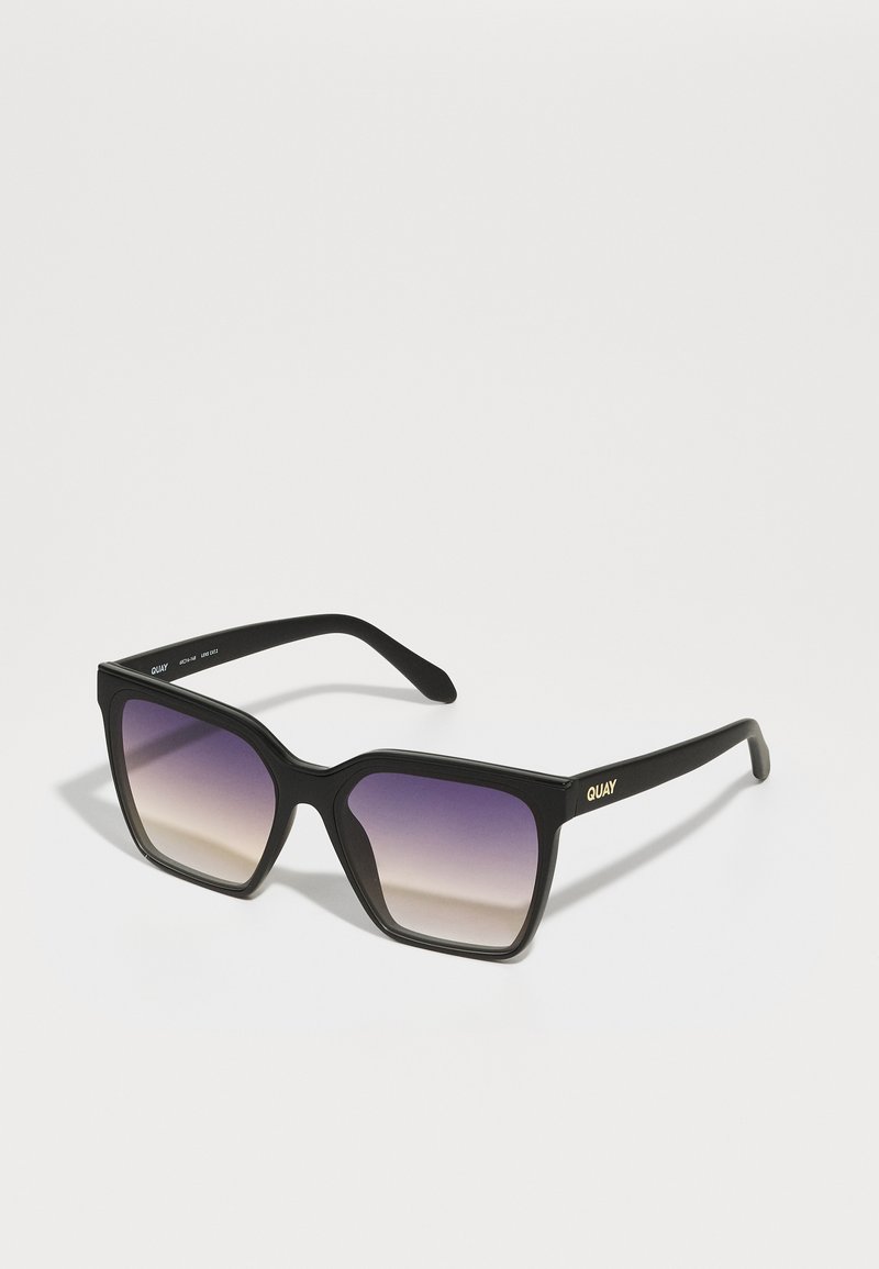 Black square sunglasses with gradient lenses, transitioning from purple to clear. Features a bold frame and a subtle gold logo on the side.