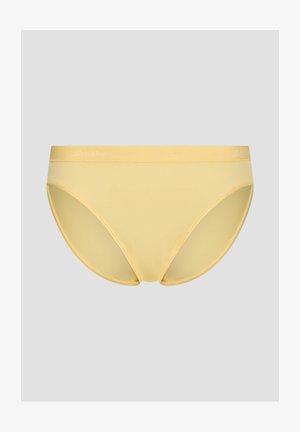 Gelbe nahtlose Unterwäsche im Bikini-Stil aus glattem Stoff mit elastischem Bund vor hellem grauem Hintergrund.