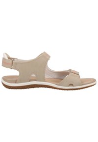 Sandal beige con tomaia in morbido suede, design open toe, cinturino alla caviglia e suola bianca. Presenta una suola in gomma marrone testurizzata.