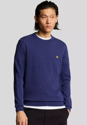 Maglione blu navy realizzato in materiale morbido, con scollo rotondo e polsini a coste, decorato con un piccolo logo giallo sul petto.