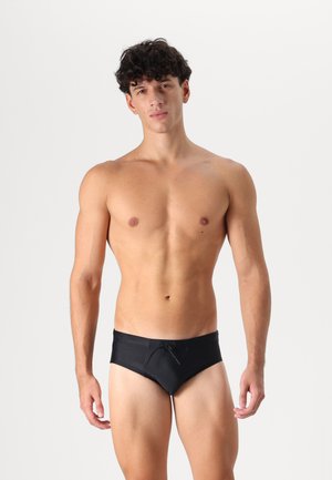 Caleçons de bain noirs en tissu lisse, avec une taille à cordon de serrage et un design ajusté, présentant une couleur unie sans motifs.