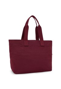 Maroon tote bag with textured surface, dual fabric handles, and rectangular shape. Features a top zipper and minimalist design.