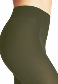 Leggings verde oliva con una texture a coste, alta vita e finitura liscia, progettati per modellare e adattarsi al corpo.