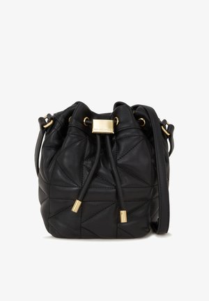 Black leather bucket bag featuring quilted design, gold-tone hardware, drawstring closure, and a detachable shoulder strap.