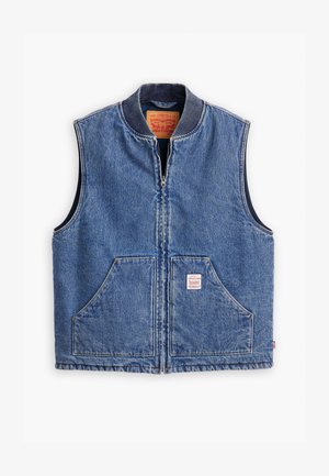 Veste en denim avec fermeture éclair à l'avant, col côtelé, deux poches avant et une étiquette. Présente un délavage bleu classique et une conception structurée.