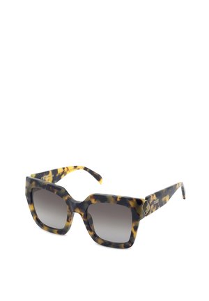Lunettes de soleil carrées avec montures en écaille de tortue et verres dégradés foncés, dotées d'un petit emblème décoratif sur les branches.