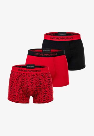 Three pairs of Emporio Armani boxer briefs: one black, two red with different patterns, featuring elastic waistbands with logo accents.