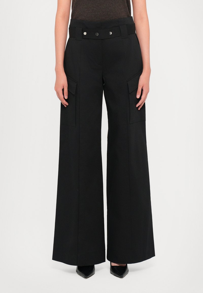 Black wide-leg trousers made from a lightweight material, featuring a high waistband, two front patch pockets, and a smooth texture.