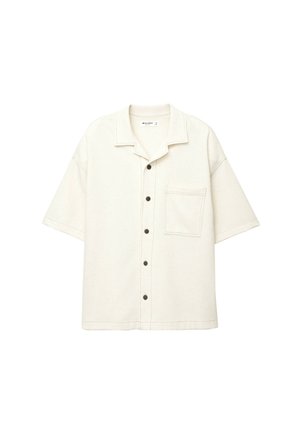 Kurzärmliges, mit Kragen versehenes Hemd aus hellbeigem Stoff. Verfügt über eine Brusttasche und schwarze Knöpfe an der Vorderseite.