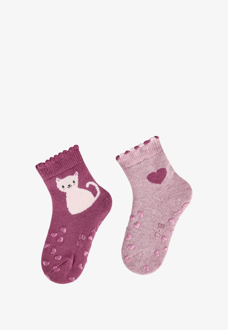 Lila Socken mit einem weißen Katzenmotiv auf einer Socke und einem Herz auf der anderen. Strukturierte Sohlen mit Punkten für besseren Halt; Rüschenkante am Bund.