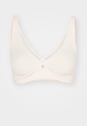 Reggiseno wireless di un rosa chiaro con design a scollo a V, tessuto liscio e spalline sottili. Presenta un piccolo dettaglio metallico sul davanti.