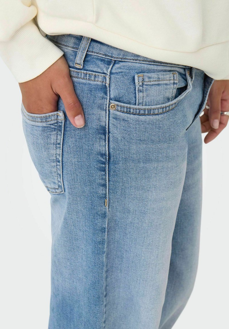 Levi's 501 high waist straight leg jeans met medium wassing • Indigo