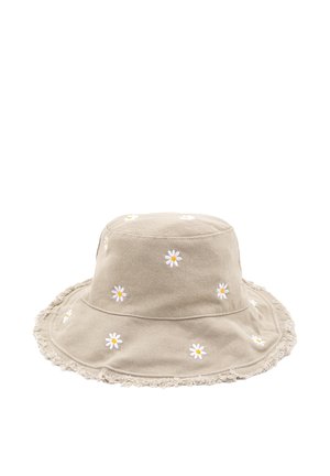 Beige színű pamut vödörkalap, szétfröccsent széllel és fehér margaréta hímzéssel. Kerek teteje laza formájú, alkalmas hétköznapi viseletre.