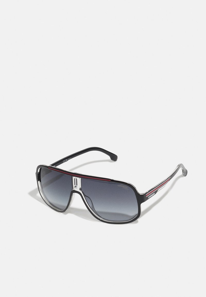 Mustad prillid, millel on paks raam, degradee läätse, metallist detailid ja punane triip käte peal. Nurgeline kuju ja läikiv viimistlus.