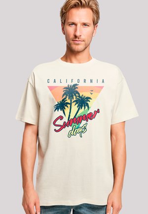 Cream-colored short-sleeve T-shirt with palm tree graphic and retro "California Summer days" text, featuring a triangle color gradient design.