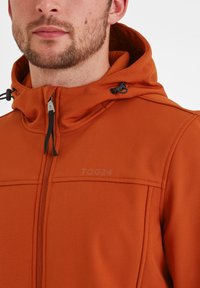 Orange hooded jacket made from soft fabric, featuring a front zipper, drawstring, and subtle TOG24 logo on the chest. Smooth texture.