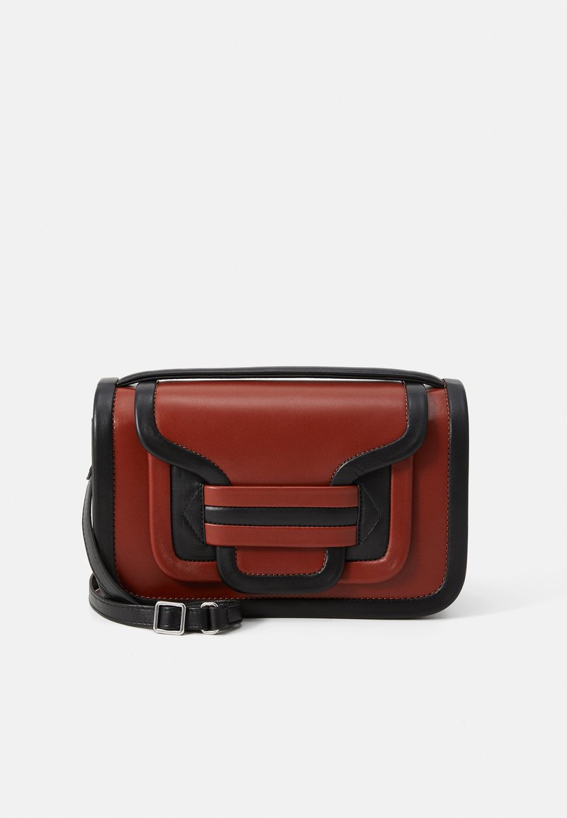 Rectangular brown leather crossbody bag with black trim, front flap with geometric accents, and adjustable black strap with silver buckle.