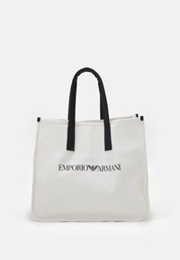 Sac fourre-tout en toile blanc avec des poignées noires et logo Emporio Armani imprimé en noir au centre avant.
