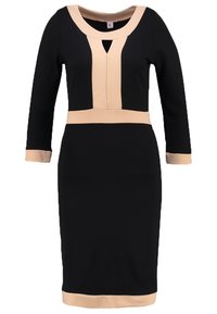 Czarna sukienka o dopasowanym kroju z dekoltem, talią i mankietami w odcieniu nude. Posiada geometryczny wycięcie w okolicy dekoltu. Długie rękawy.