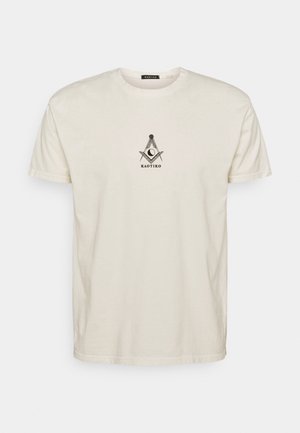 White short-sleeve T-shirt with a small black geometric design and "KAOTIKO" text centered on the chest.